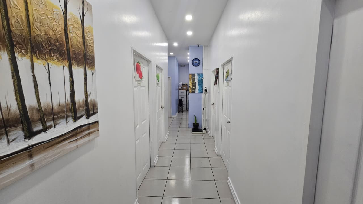 Clinic hallway leading to consultation rooms